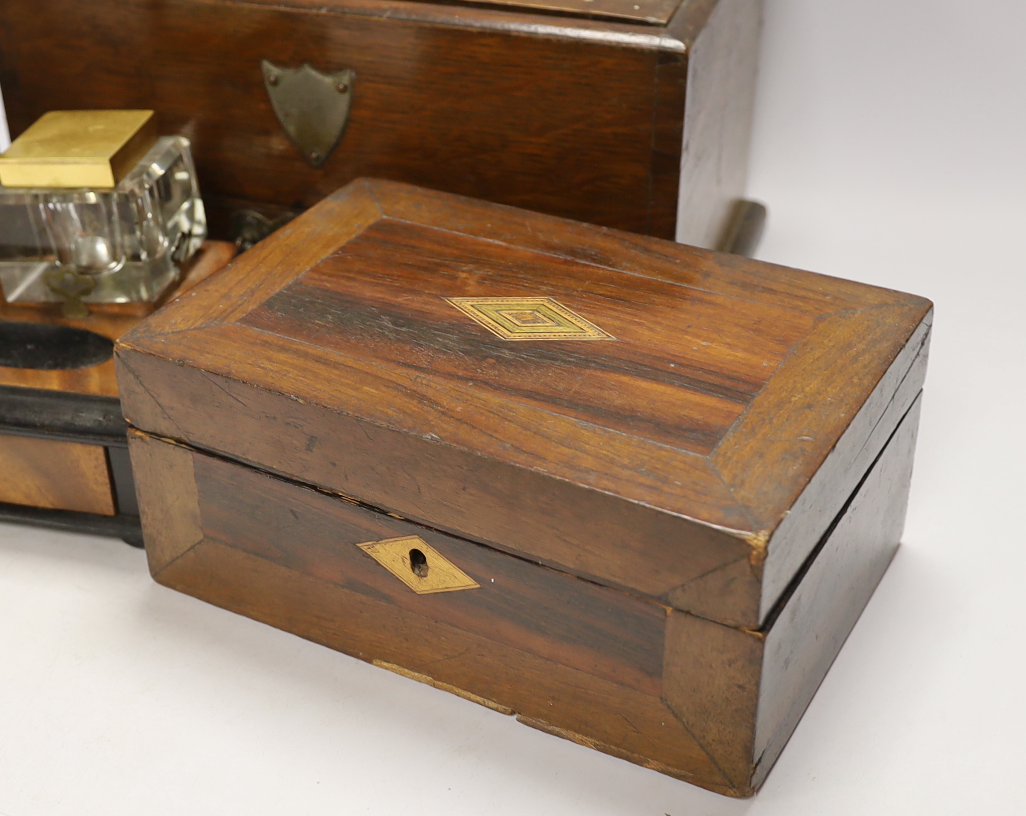 A walnut inkstand, an oak strong box and a rosewood box, 30cm x 18cm high